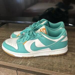 Women’s Nike dunks in the “teal zeal” color. Size 8.5